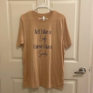 Beige tee with writing on it